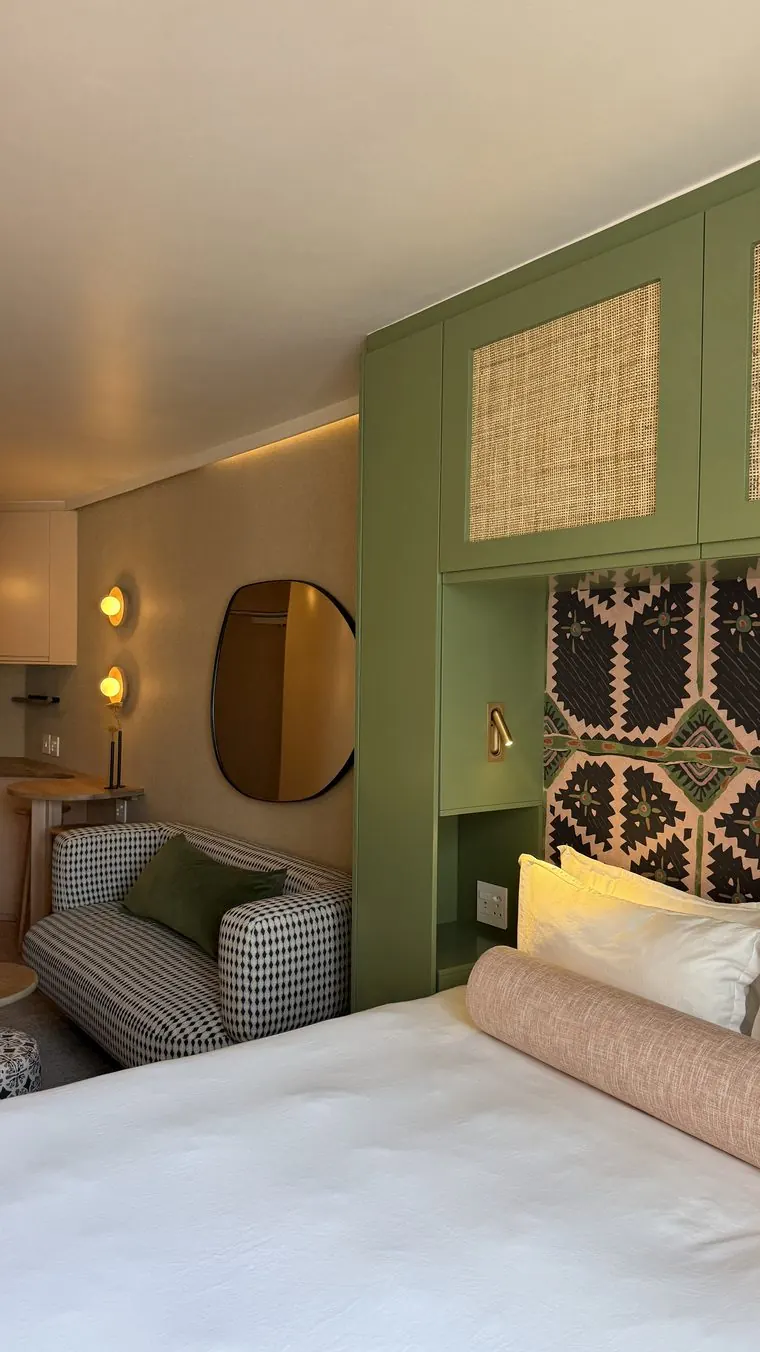 The green joinery and the bed