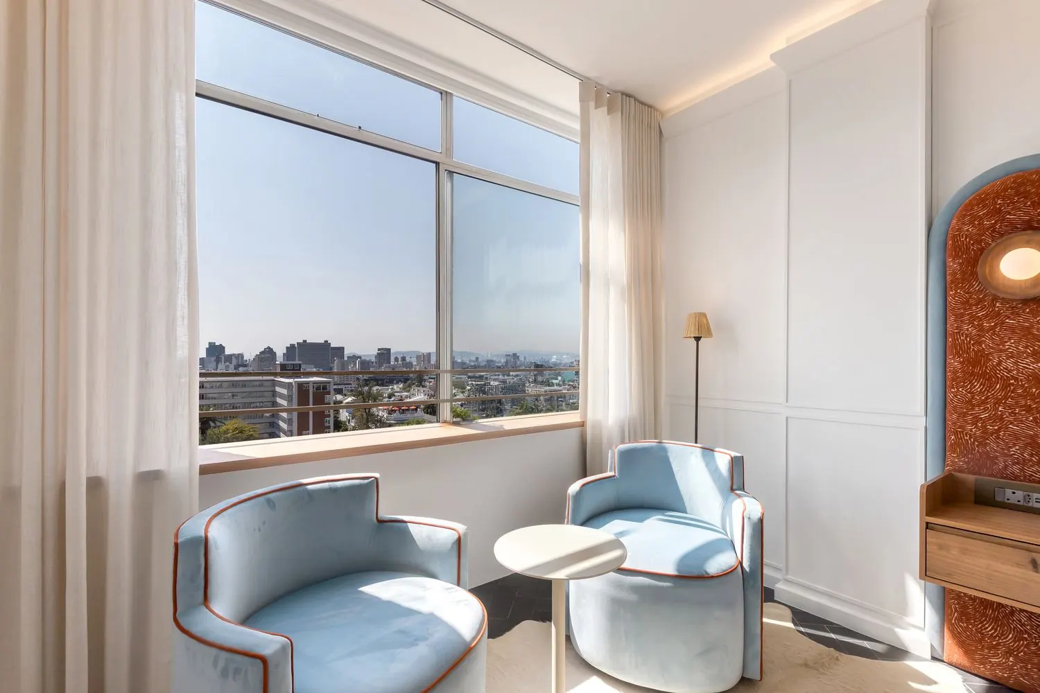 The two chairs at the window